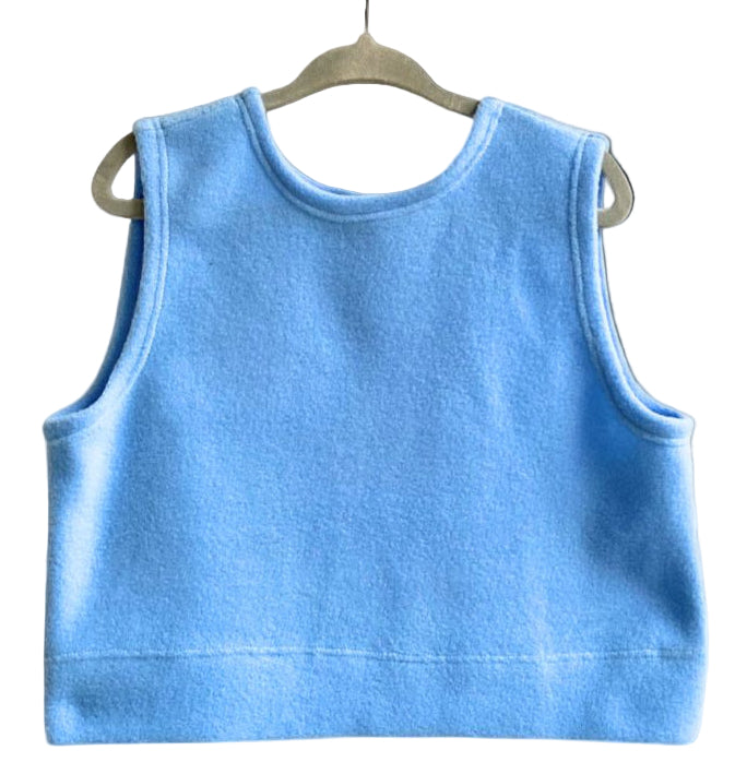Blue tank top on a hanger against a white background